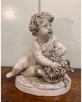 Le village de 58 brocanteurs - Lebrun : Putti en terre cuite émaillée